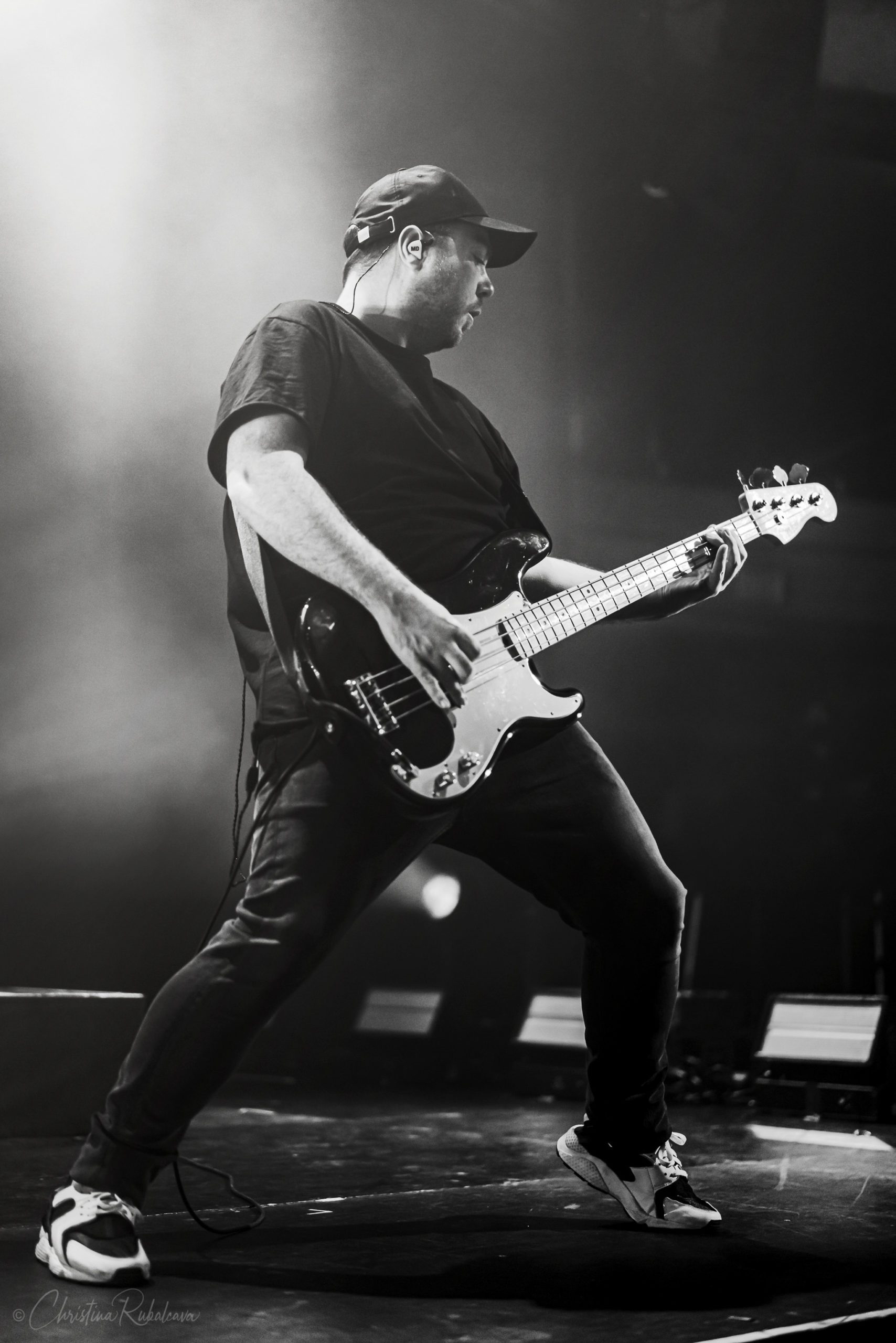 black and white image of Martin playing the bass guitar