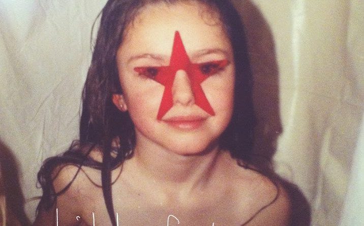 Album art cover for Amaara. Picture of a young girl in what appears to be a tub. White shower curtain background. Girl with no shirt, wet hair and a painted red star on her face