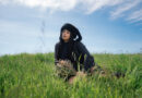 King Isis Sitting in a grass field