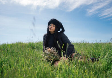 King Isis Sitting in a grass field